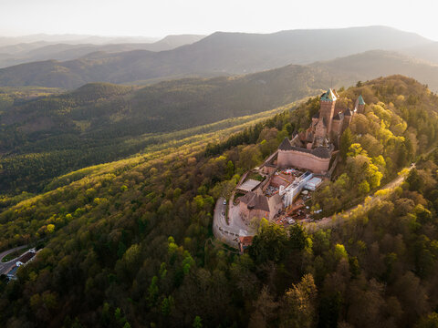 Castle Haut-Koenigsbourg, Alsace, France - April 10, 2026 - Aerial study highlighting castle layout and defensive geometry, detailed rooftops, towers and curtain walls visible from oblique angle,