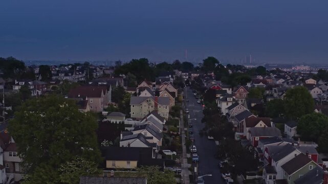 Twilight aerial view of suburban town of East Rutherford in New Jersey, USA with Meadowlands and Manhattan skying in the distance