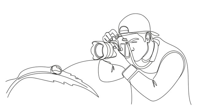 One line drawing of a photographer capturing a macro dewdrop