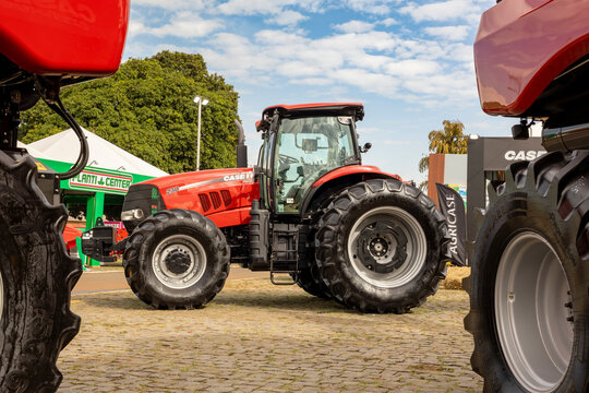 Case IH Puma 230 tractor with pressurized cab, dual rear wheels, and assisted drive on an agricultural display lot.