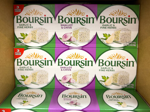Prosper, Texas, USA - May 06th, 2026: Boursin garlic and fine herbs and shallot and chive gourmet spreadable cheese boxes in Costco Wholesale warehouse store