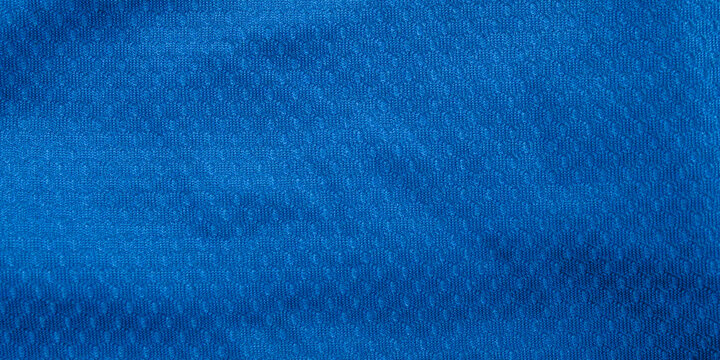 Close up of bright blue sports mesh fabric texture with detailed micro hole pattern
