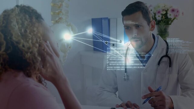 Patient raising hand to head, starting medical network near spine model while doctor writing notes