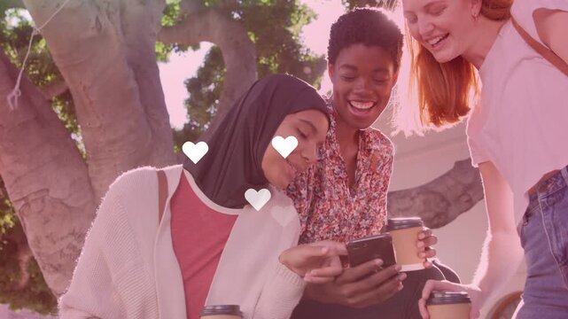 Three women bench mid scrolling phone left tapping causing hearts growing lens flare marketing