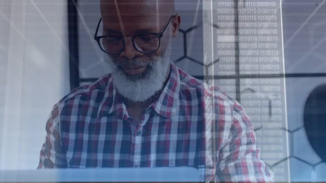 Male developer typing at laptop in office causing cloud overlay and binary panel while syncing data