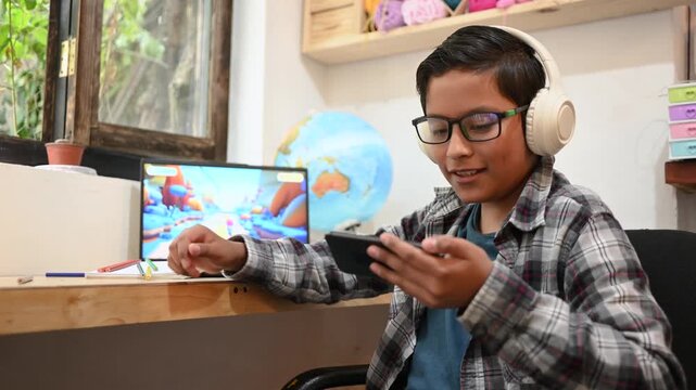 Mexican teenager with headphones excitedly playing a racing video game on a smartphone
