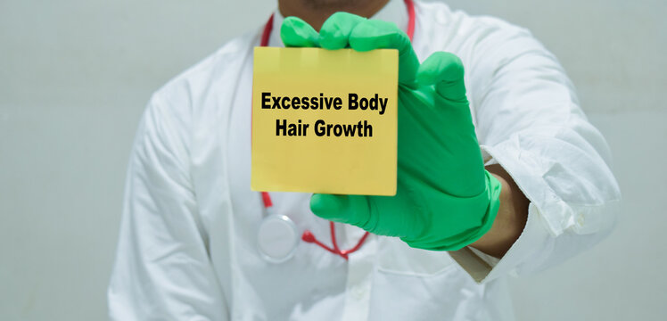 Doctor holds in hands a card with the name of the excessive body hair growth. Medical concept