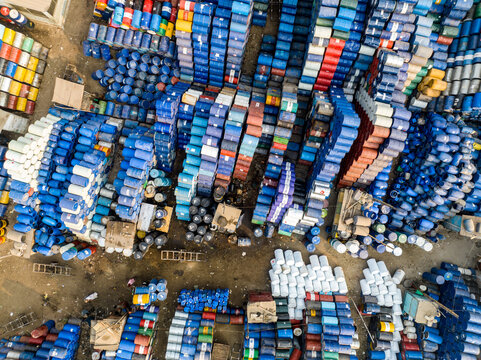Aerial view of thousands of colorful industrial barrels stacked in an outdoor storage facility in Dhaka, Dhaka Division, Bangladesh.