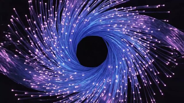 Fiber optic strands glowing in purple and blue for creative digital media and visual arts