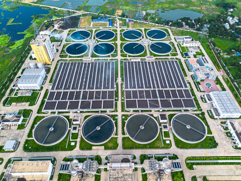 Aerial view of Sewage Treatment Plant, Dhaka WASA showing circular clarifiers and rectangular filtration basins Dhaka, Dhaka Division, Bangladesh.