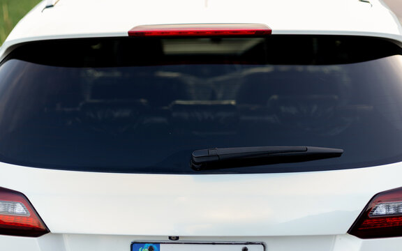 Close Up of Rear Wiper on Back Glass of White Crossover Vehicle