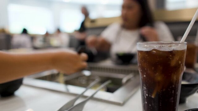 Close Up of Cola Drink at Asian Barbecue Buffet Restaurant