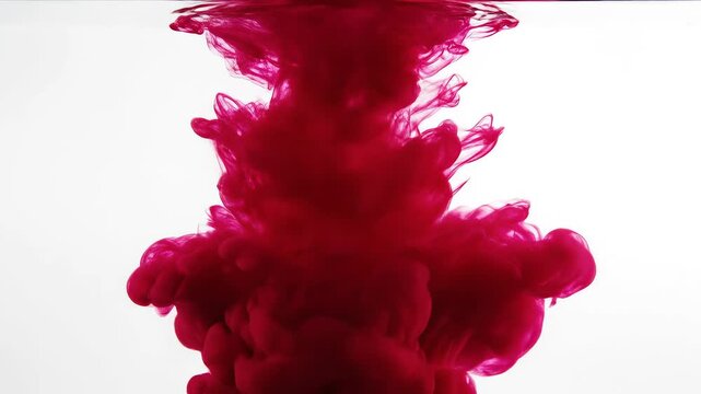 Red ink dispersing in water for creative digital media and visual arts