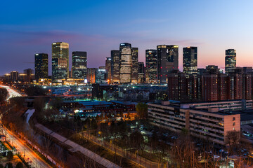 Naklejka premium Riverside urban night view of Beijing Lize Financial Business District