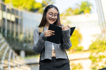 Education concept, Happy asian female university student reading educational book, Smiling young...