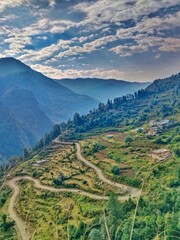 Fototapeta premium aerial view of mountains nature, tourism, travel, green, india, village, hometown,phadi lifestyle, indian village,forest, grass, valley, summer, landscapemountain, sky, mountains, alps, view, peak, cl