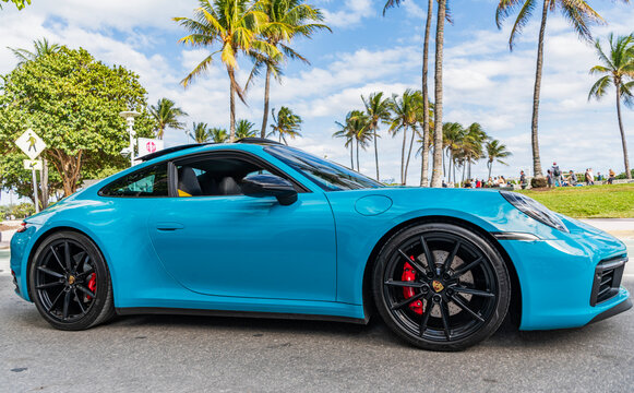 Miami, Florida, USA - January 25, 2025: Luxury car Porsche 911 Carrera 4S. Car Porsche 911 Carrera 4S on the road. Blue car, side view. 2020 Porsche 911 Carrera 4S sport car