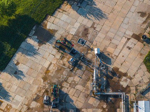 Aerial view of the UGS Damborice facility with pumpjacks and industrial pipelines on concrete slabs Damborice, South Moravian Region, Czechia.
