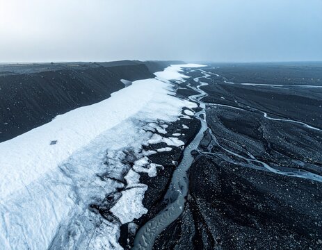 Melting Glacier Ice on Volcanic Gravel with Ash Streaks