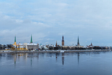 Obraz premium Winter Panorama of Riga Old Town with Riga Castle on Daugava River, Latvia