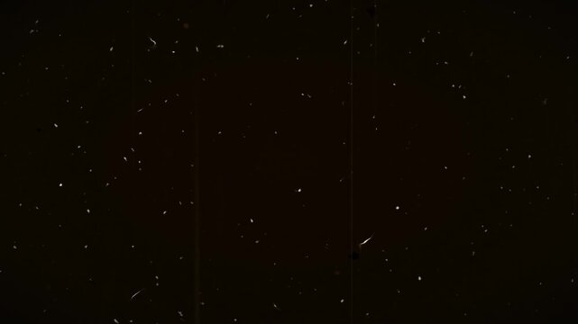 4K film grain scratch damage screen texture on dark background 3d animation with hairs and dust particles to be used over another footage to make it look old, damaged and retro. 