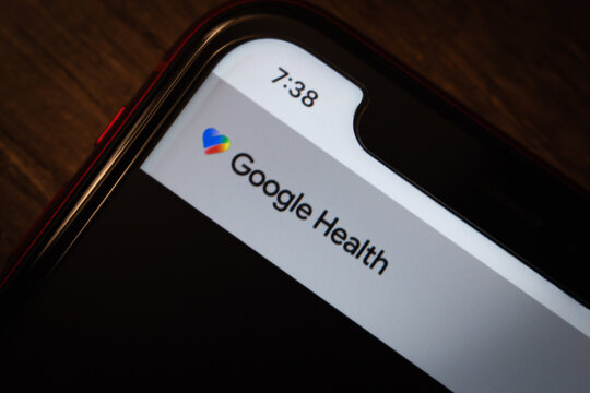 Mexico City, MEXICO - May 11 2026 : Close-up of a smartphone on a wooden surface displaying the Google Health website.
