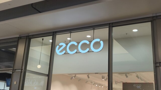 Vilnius Lithuania 09.05.2026 Ecco footwear store illuminated logo inside modern shopping mall premium shoe retail branding and contemporary commercial interior with stylish architecture