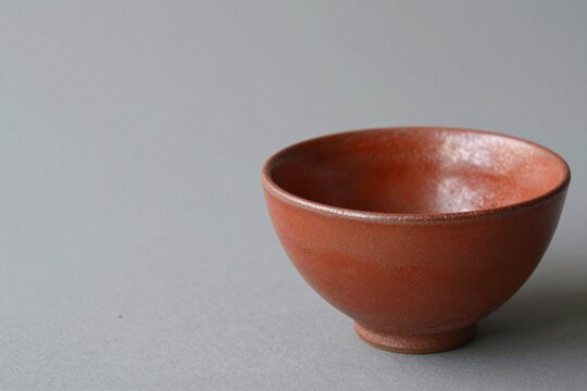 Japanese red raku matcha tea bowl, copy space