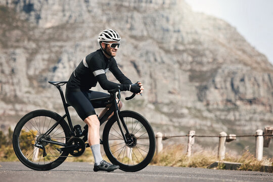 Thinking, man and cyclist with bicycle outdoor for fitness, exercise and endurance training. Mature person, vision and bike for workout challenge, cycling sports and triathlon competition in nature