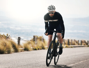 Naklejka premium Fitness, cycling or man on road with bike, endurance training or challenge in cardio workout. Serious, space or mature cyclist outdoor on bicycle, physical activity or riding practice in sports hobby
