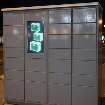 Smart parcel locker with digital package visualization at night