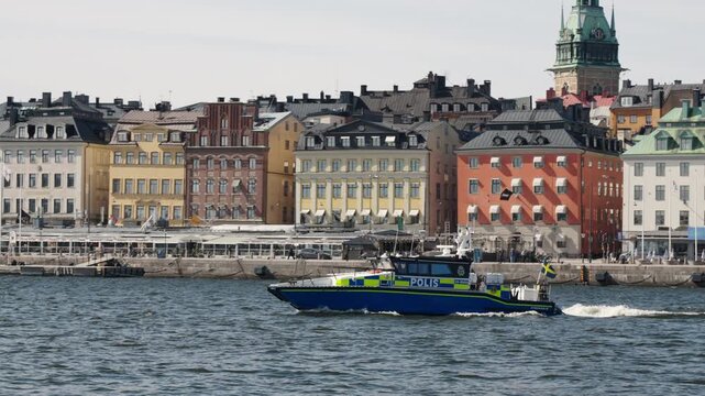 Police boat patrolling in the waters outside on the old town in Stockholm, Sweden