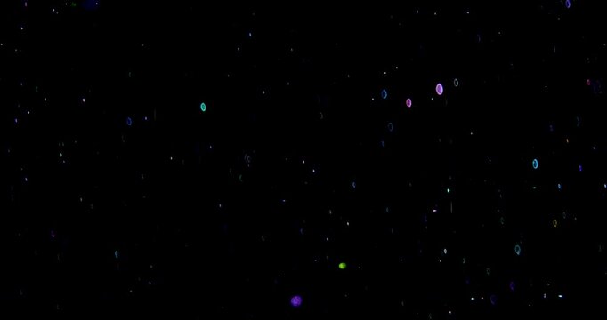 Smooth Floating Colorful Particles. Smooth gentle movement of small glowing multicolored particles on black background.