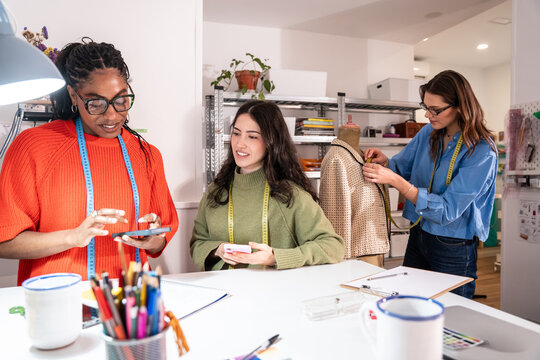 Multiethnic women working in atelier with teamwork vibe