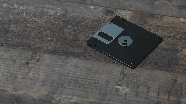 Floppy disk shown on wooden table in four different frames