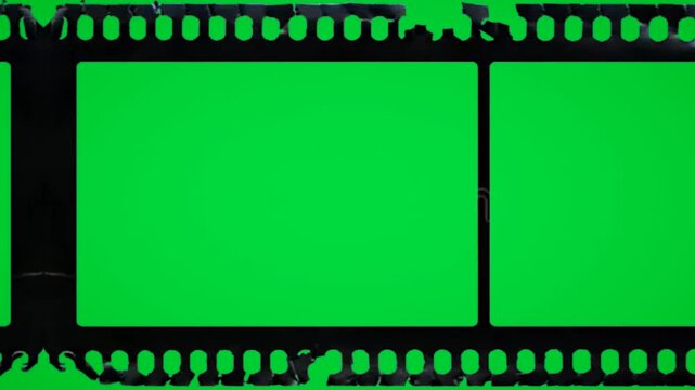 Torn Ripped Edge negative film strip on green screen chroma key background. rough grunge break style stock footage for cinematic video editing and creative media projects. overlay multimedia