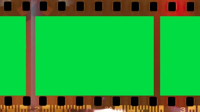 Brown Red Retro Border negative film strip on green screen chroma key background. colorful vintage reel style stock footage for cinematic video editing and creative media projects. element design
