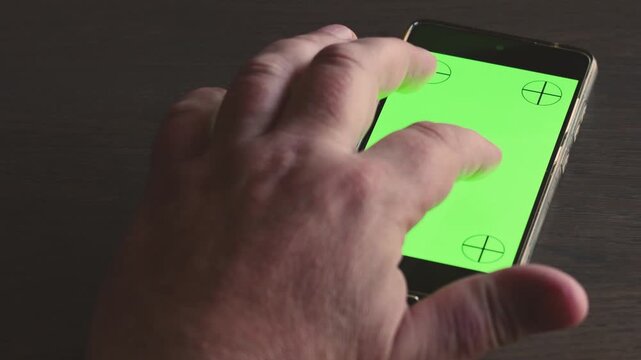 Exploring smartphone interface with green background and anchor points for graphic design purposes
