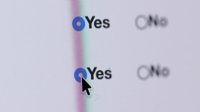 4K macro view of a cursor selecting "Yes" and then changing the selection to "No" in a list of radio buttons for policy agreement.