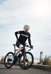 Naklejka premium Person, cyclist and back pain with bicycle outdoor for bad posture, discomfort or health strain. Fitness, cycling and man with sore muscle, bike injury or joint inflammation for workout on road