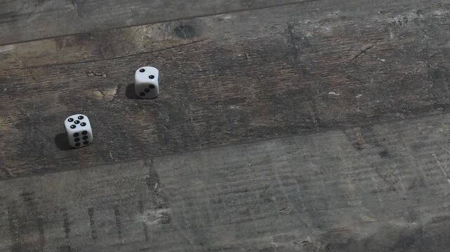 throw dice on a wooden table 5-2 6-3. in a casual setting during the day