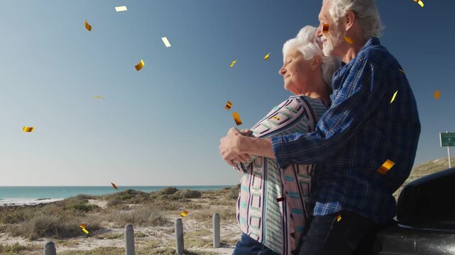 Man stepping behind woman at ocean by car, embracing while gold confetti falling, rising for health