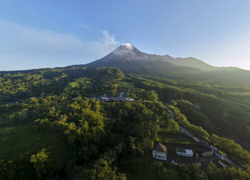 Aerial view of Bunker Kaliadem Merapi at the foot of Mount Merapi volcano surrounded by lush green forests and roads Kecamatan Pakem, Daerah Istimewa Yogyakarta, Indonesia.