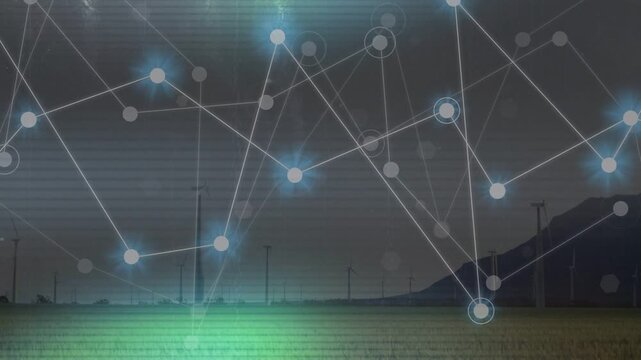 Left-side glow sparking network overlay growing pulsing linking across wind farm mapping sensors