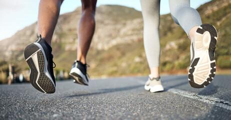 Fototapeta premium Running, fitness and shoes of couple outdoor in street for workout, training partner and health. Wellness, exercise and cardio challenge with feet of people in nature for runner, support and jogging