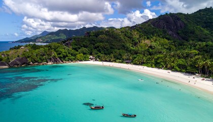 Obraz premium Aerial view of a tropical beach with turquoise water and lush green mountains.