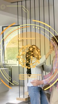 Vertical video: Pair handholding pulling into hug showing love near stairs orange AR HUD overlaying
