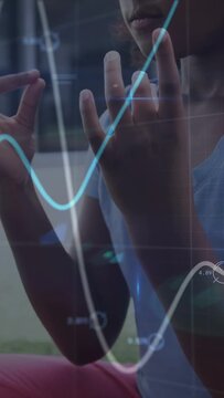 Vertical video: Seated girl breathing forming mudras by window data lines touching hands for health