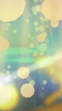 Vertical video: Light bokeh drifting after hex flare from left, pulsing and forming backdrop glow