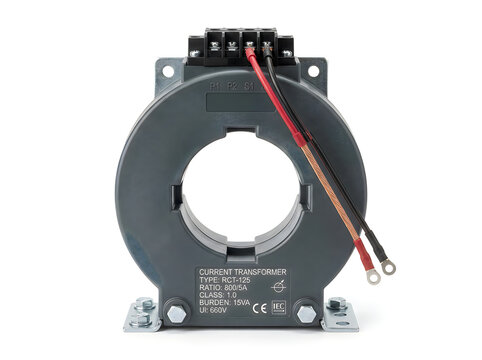 Industrial current transformer with copper and red wiring connected, detailed close-up shot showcasing electrical components and CE certification markings